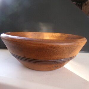 hand made wooden bowl by treeware . made in u s a